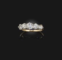 A five-stone diamond ring, designed as a line of graduated circular-cut diamonds totalling