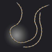 A diamond-set gold necklace and bracelet, the front section of the necklace set with round