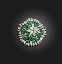 An emerald and diamond brooch, centring on a cluster of marquise-shaped diamonds within concentric