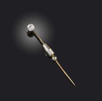 A diamond solitaire stickpin, set with an old cushion-shaped diamond weighing approximately 0.