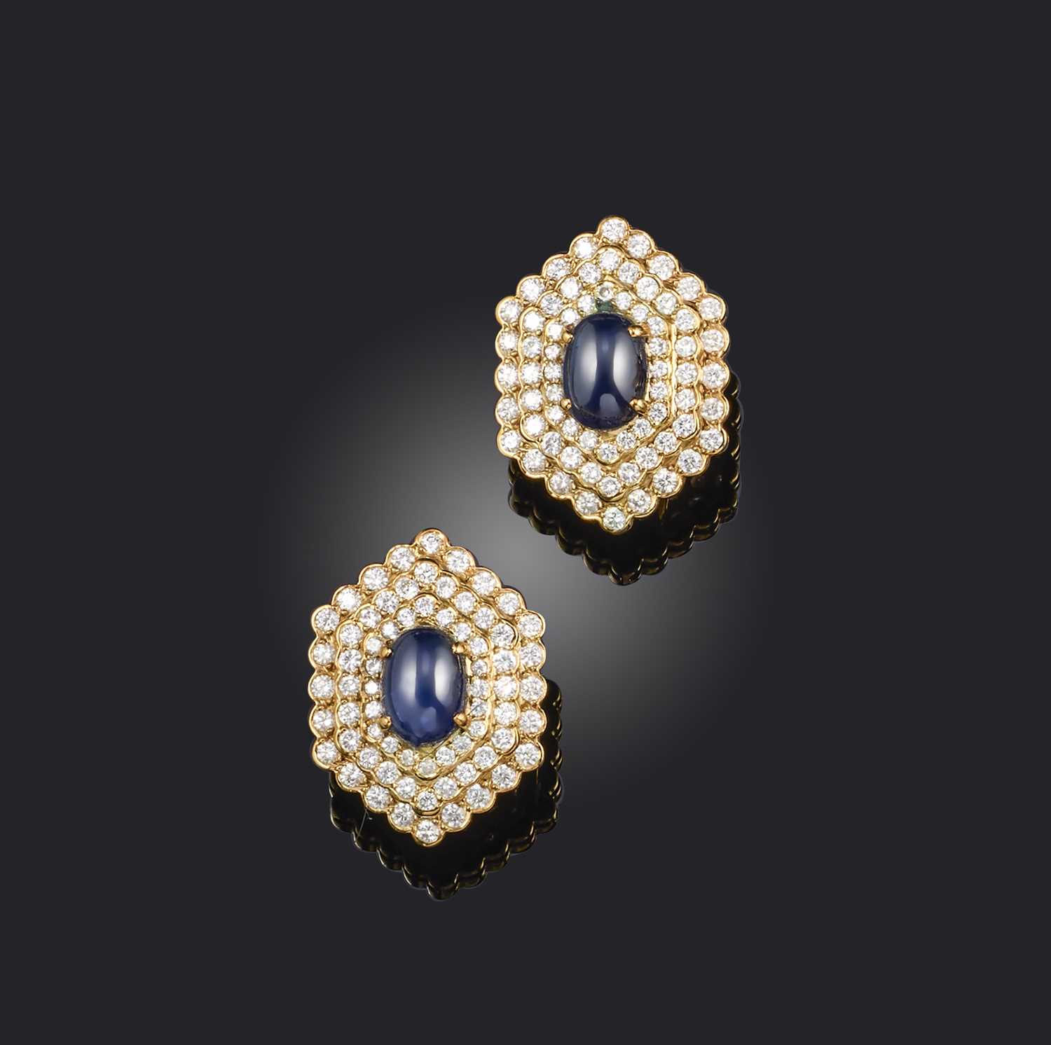 Vourakis, a pair of sapphire and diamond ear clips, each of hexagonal outline, set with cabochon