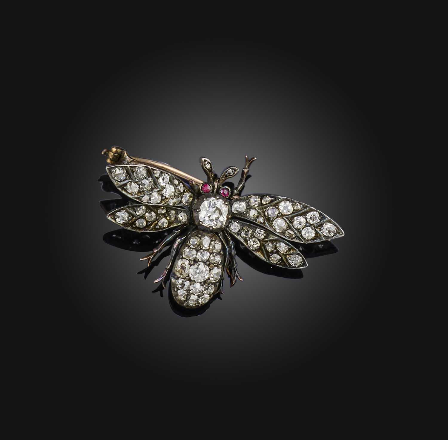 A Victorian diamond and ruby brooch, late 19th century, designed as a bee, set with cushion-shaped