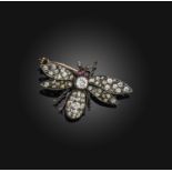 A Victorian diamond and ruby brooch, late 19th century, designed as a bee, set with cushion-shaped