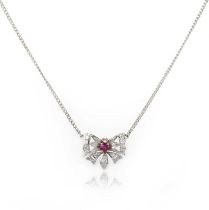 A ruby and diamond pendant necklace, designed as a butterfly, set with a circular-cut ruby and