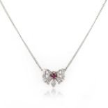 A ruby and diamond pendant necklace, designed as a butterfly, set with a circular-cut ruby and