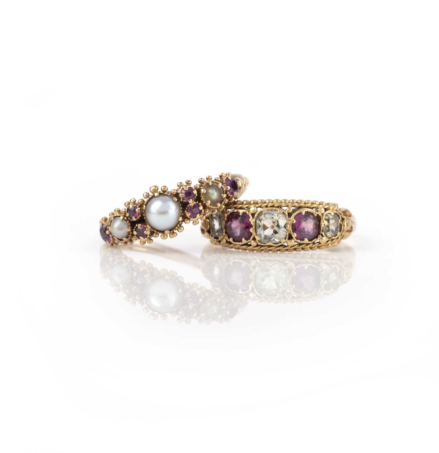 Two gem-set rings, early-mid 19th century, each of half-hoop design, mounted in gold, one set with