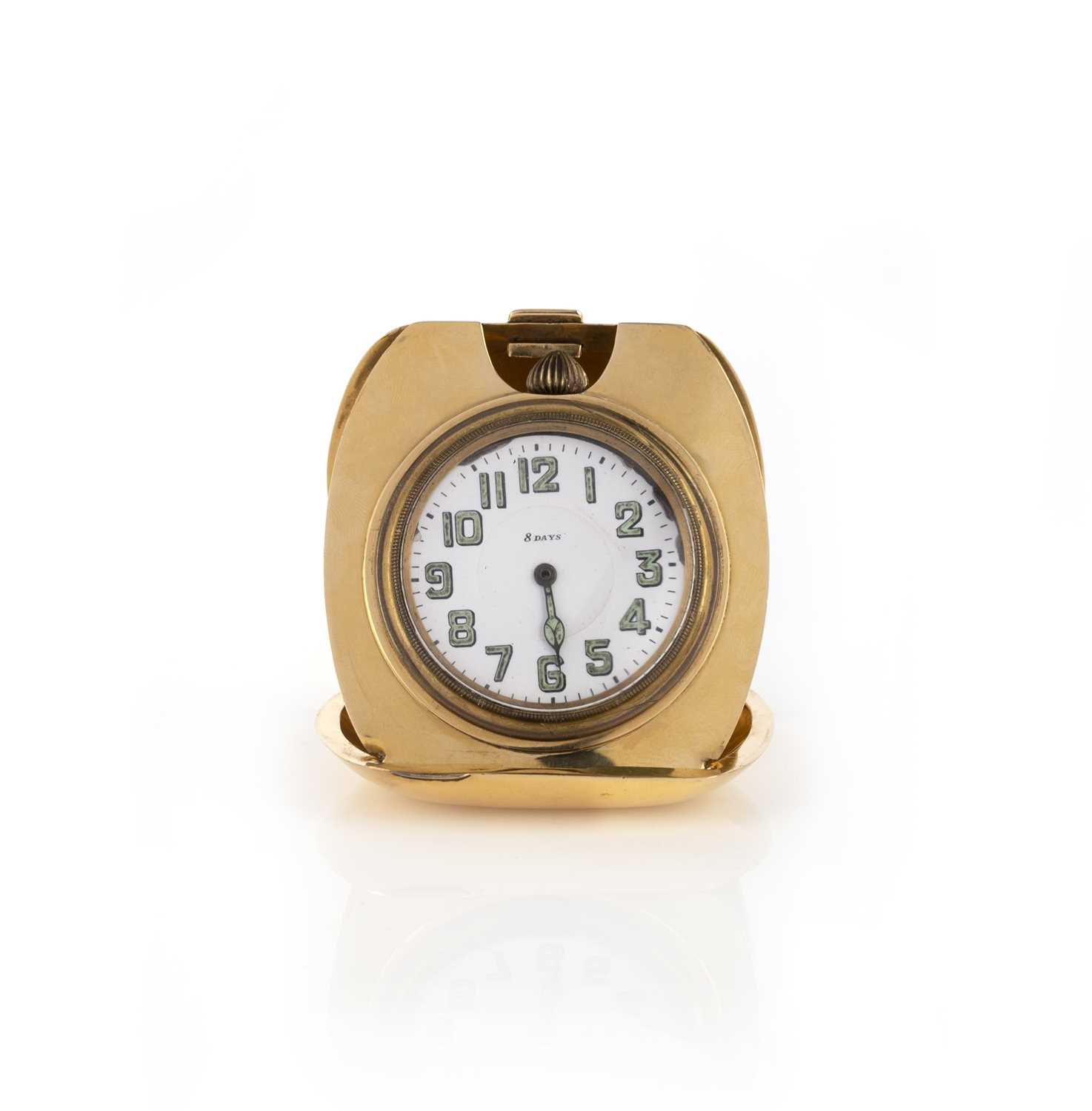 Tiffany & Co. and Octava Watch co., a gold travel clock, mid 20th century, the circular dial with