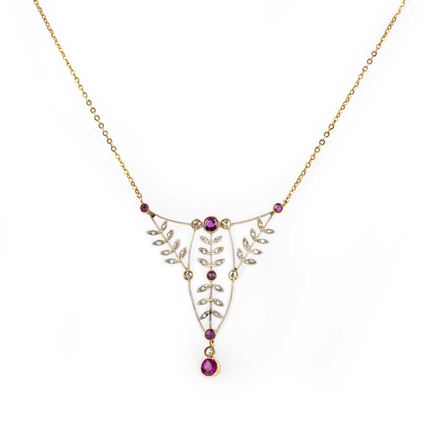 A Belle Epoque ruby and diamond pendant, set with graduated circular-cut rubies within diamond-set