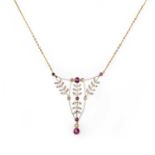 A Belle Epoque ruby and diamond pendant, set with graduated circular-cut rubies within diamond-set