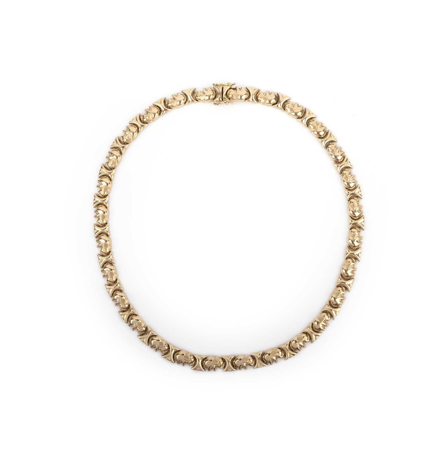 A gold necklace, the articulated collar composed of links designed as elephants, length 43.5,