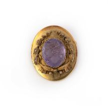 An amethyst cameo brooch, second half of 19th century, the oval amethyst carved with the profile