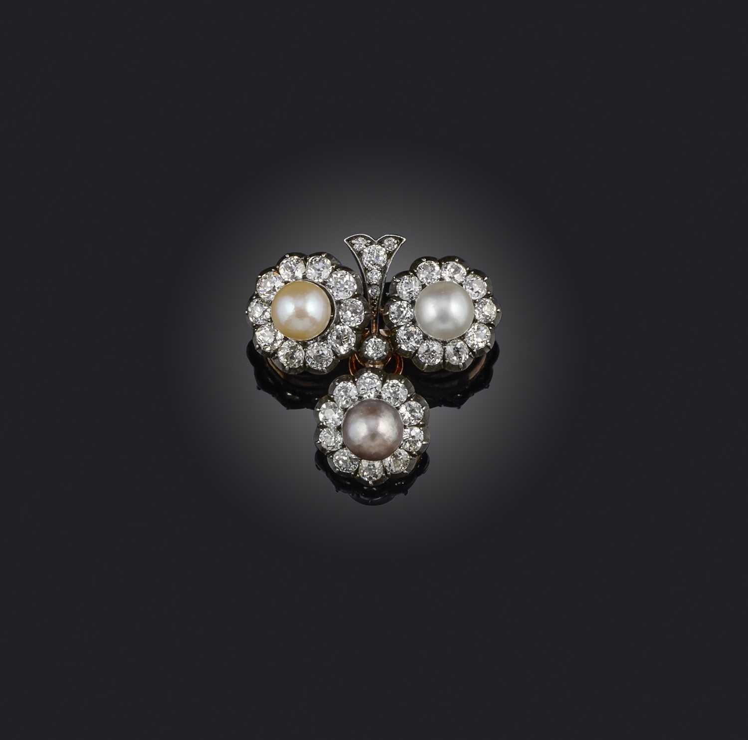 A natural pearl and diamond brooch, late 19th century, designed as a three-leaf clover, set with