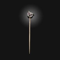 A late 19th century owl stickpin, set with rubies and diamond, mounted in silver and gold, width