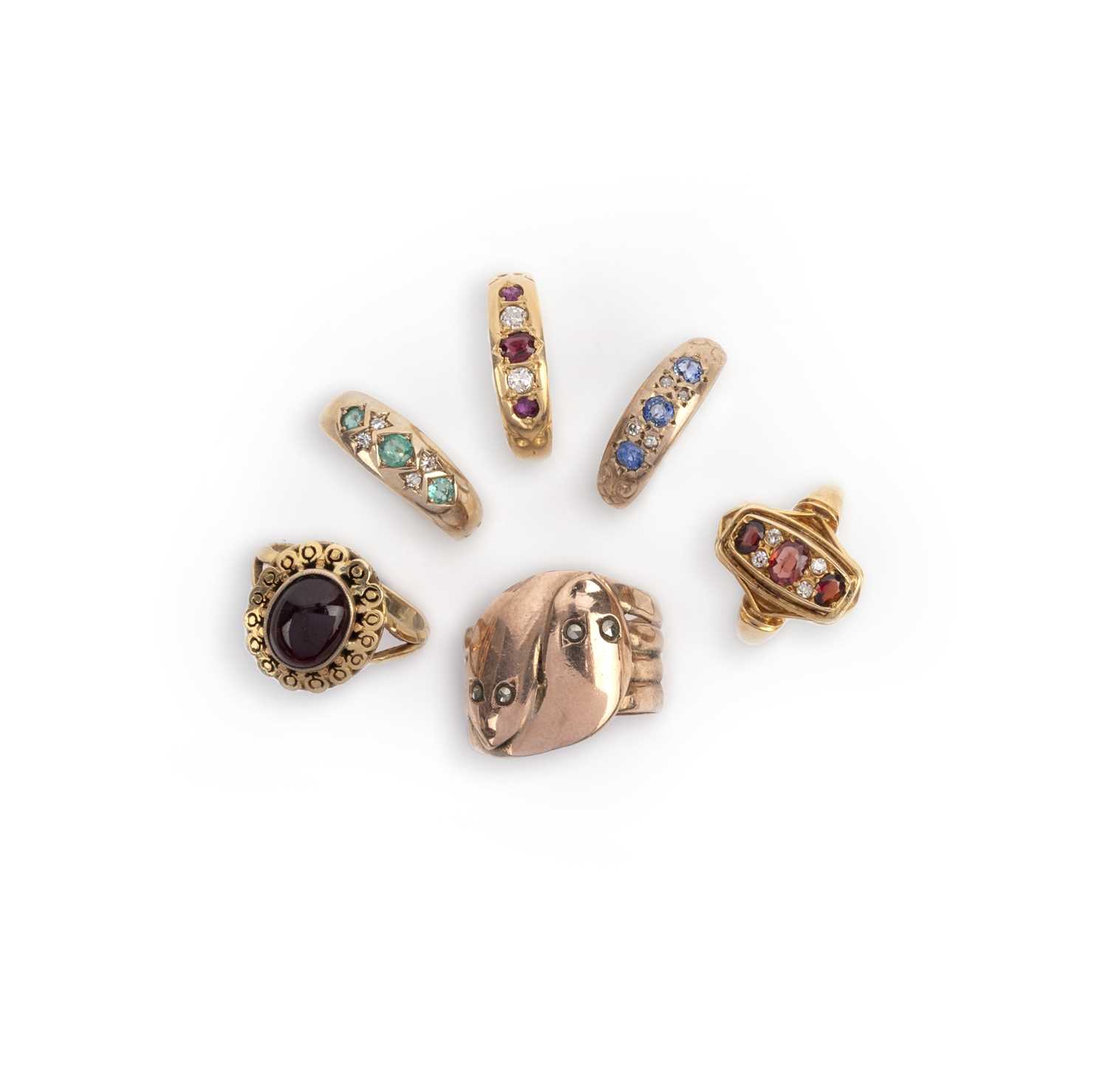 Six gem-set rings, comprising: a 9ct wide band designed as entwined snakes, set with rose-cut