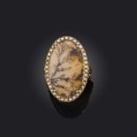 A late 18th century moss agate and seed pearl ring, the central moss agate plaque set within a