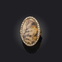 A late 18th century moss agate and seed pearl ring, the central moss agate plaque set within a