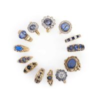 A collection of thirteen rings, comprising: a 9ct gold ring set with an oval sapphire, size O; a