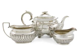 λ A matched three-piece silver tea set, comprising: a George III teapot, by Alice & George