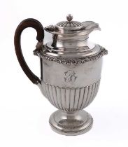 A George III silver hot water pot, by William Burwash, London 1816, vase form, part-fluted