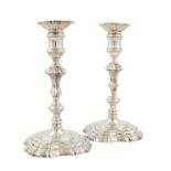 A pair of George III silver candlesticks, by William Bennett, London 1807, in the mid-18th century