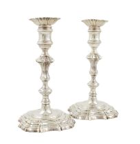 A pair of George III silver candlesticks, by William Bennett, London 1807, in the mid-18th century