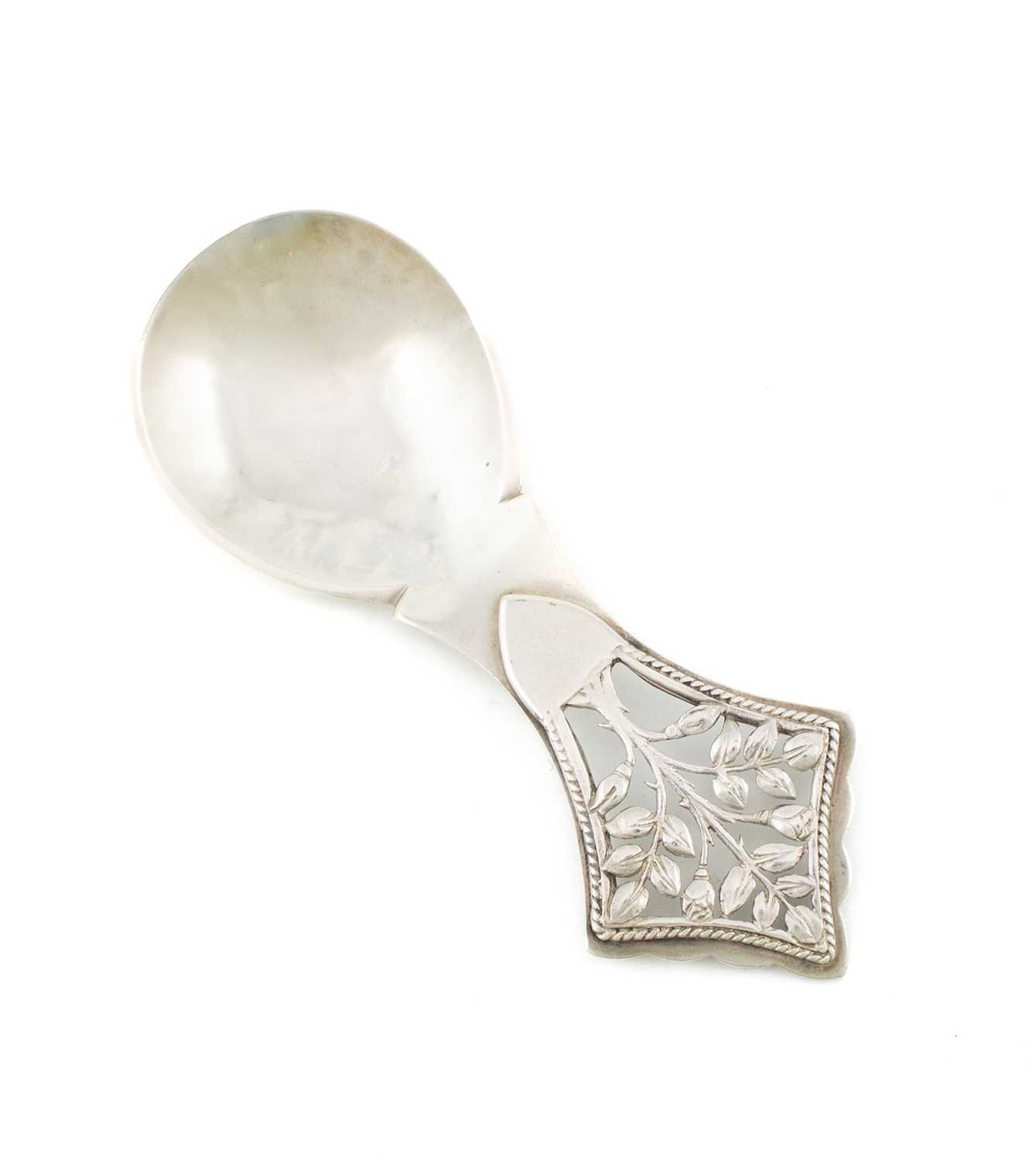 An Arts and Crafts silver Tree of Life Caddy spoon, by H. G. Murphy, London 1929, also with the