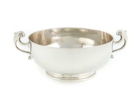 A Queen Anne silver two-handled bowl, by Edmund Pearce, London 1713, shallow circular form, scroll