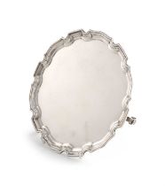 A silver waiter, by W. Greenwood and Sons, Birmingham 1935, circular form, moulded border, on