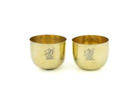 A matched pair of George II silver-gilt tumbler cups, marks worn, one London 1752, circular form,