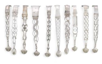 A collection of ten pairs of George III cast silver sugar tongs, various dates and makers, pierced