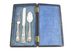 A 19th century three-piece Chinese silver christening set, by Leeching, circa 1850, comprising: a