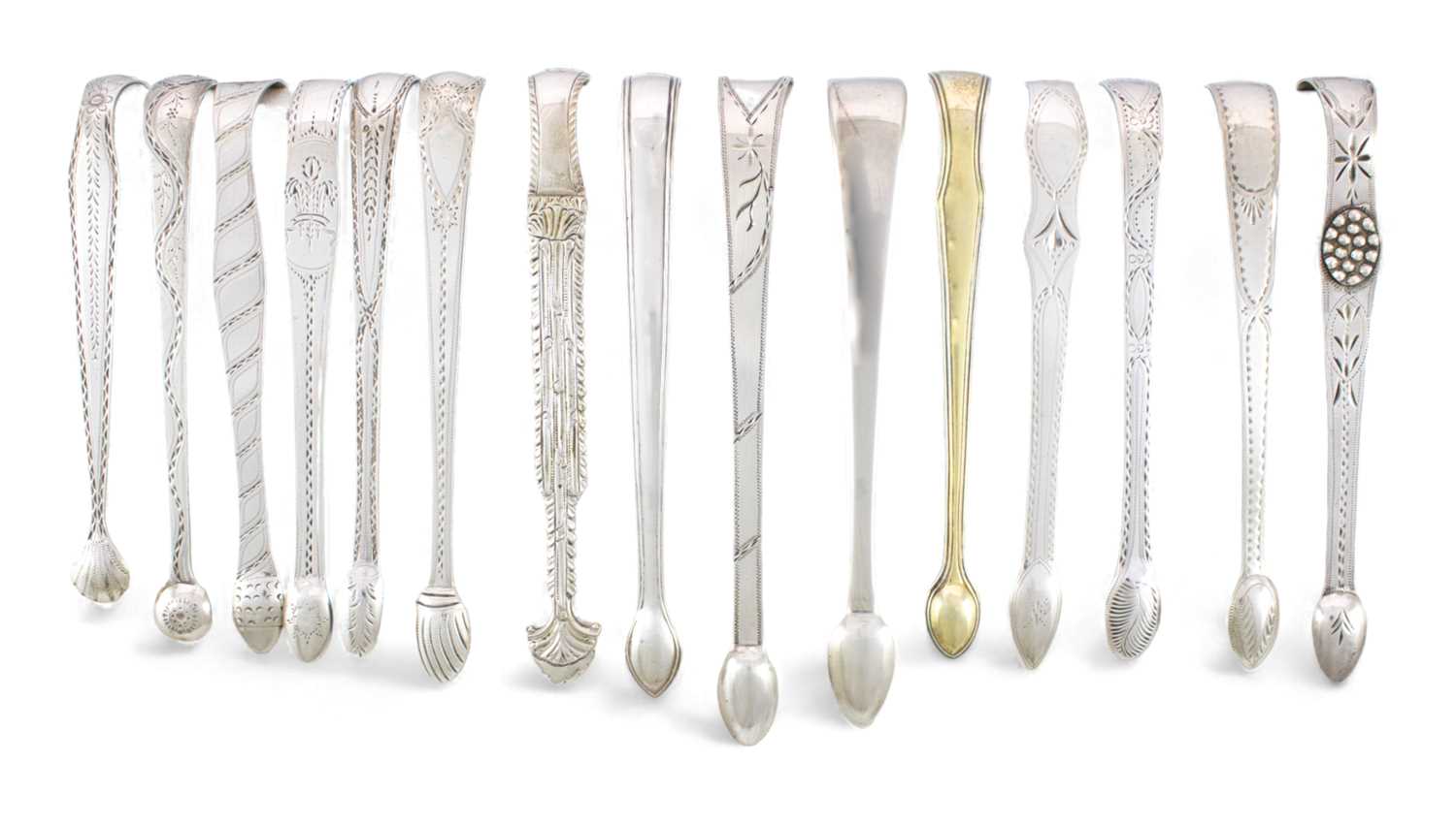 A collection of fifteen pairs of George III and George IV silver sugar tongs, various dates and