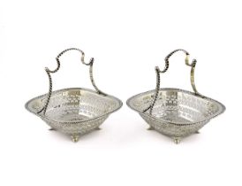 A pair of silver baskets, by Martin, Hall and Co., Sheffield 1910, rounded square form, pierced