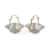 A pair of silver baskets, by Martin, Hall and Co., Sheffield 1910, rounded square form, pierced