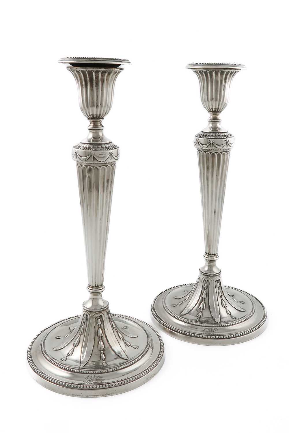 A pair of George III silver candlesticks, by Daniel Smith & Robert Sharp, London 1804, tapering