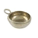 A 19th century French silver wine taster, plain circular form, double snake ring handle,