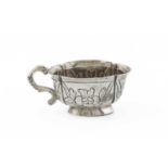 An 18th century Russian silver vodka cup, Moscow 1782, oval lobed from, foliate decoration, scroll