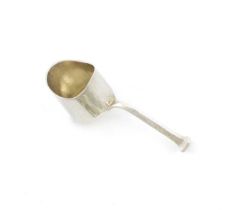 By Omar Ramsden, an Arts and Crafts silver caddy spoon, London 1931, shovel shaped bowl, tapering