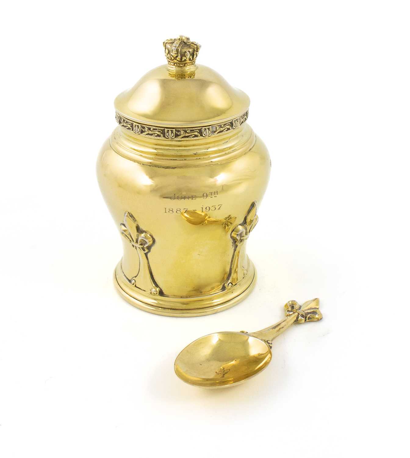 A silver-gilt tea caddy and spoon, by Goldsmiths & Silversmiths Co Ltd, London 1936, baluster