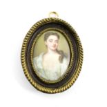 An 18th century English School enamelled portrait miniature, unsigned, the young lady in a white