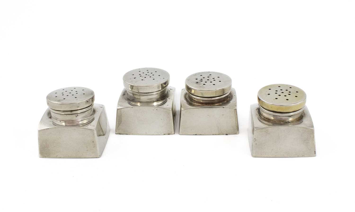 By Georg Jensen, a set of four American silver pepper pots, marked Georg Jensen Inc. U.S.A, Sterling