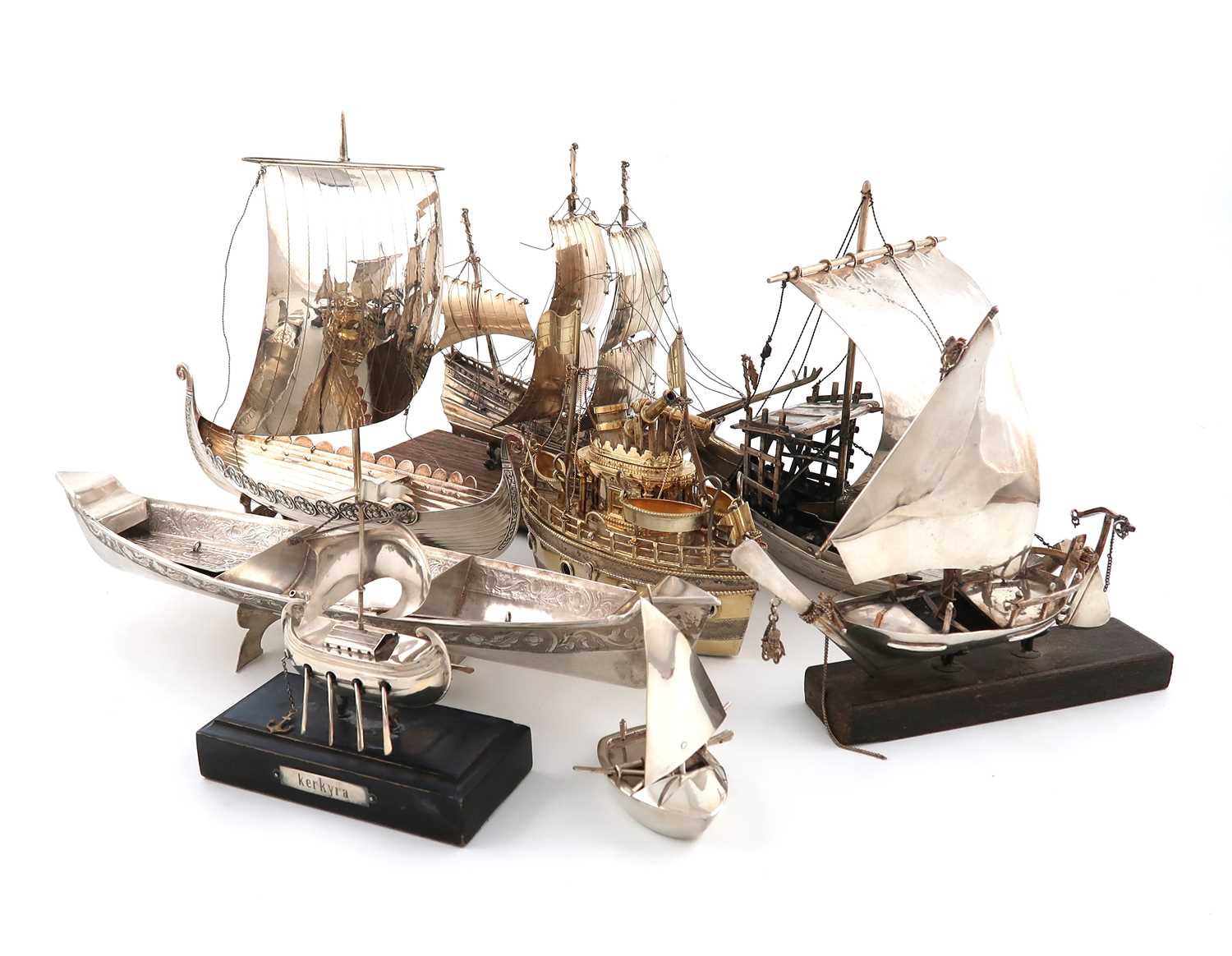 A collection of eight silver, metalware and electroplated boats, including: a Portuguese Rabelo