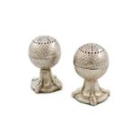 A pair of silver novelty pepper pots, by William Aitken, Birmingham 1915, modelled as golf balls,