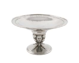 By Omar Ramsden, an Arts & Craft silver tazza, London 1928, also engraved 'Omar Ramsden Me Fecit',