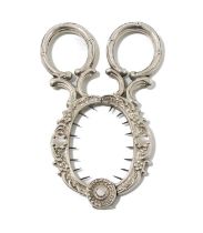 A German silver egg topper, scissor form, foliate and rocaille decoration, ring handles, length 9.