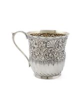 A late-Victorian silver mug, by J and W Deakin, Sheffield 1892, circular form, embossed foliate