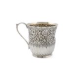 A late-Victorian silver mug, by J and W Deakin, Sheffield 1892, circular form, embossed foliate