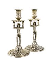 A pair of Edwardian silver Harlequin tapersticks, by George Nathan & Ridley Hayes, Chester 1906, the