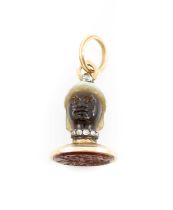 A George III gold-mounted agate fob seal, unmarked, carved as a male head wearing a Moorish