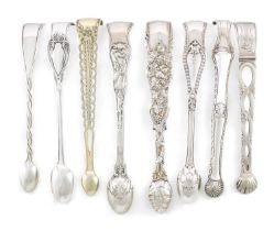 A collection of eight pairs of antique silver sugar tongs, including a Victorian Boar Hunt pattern